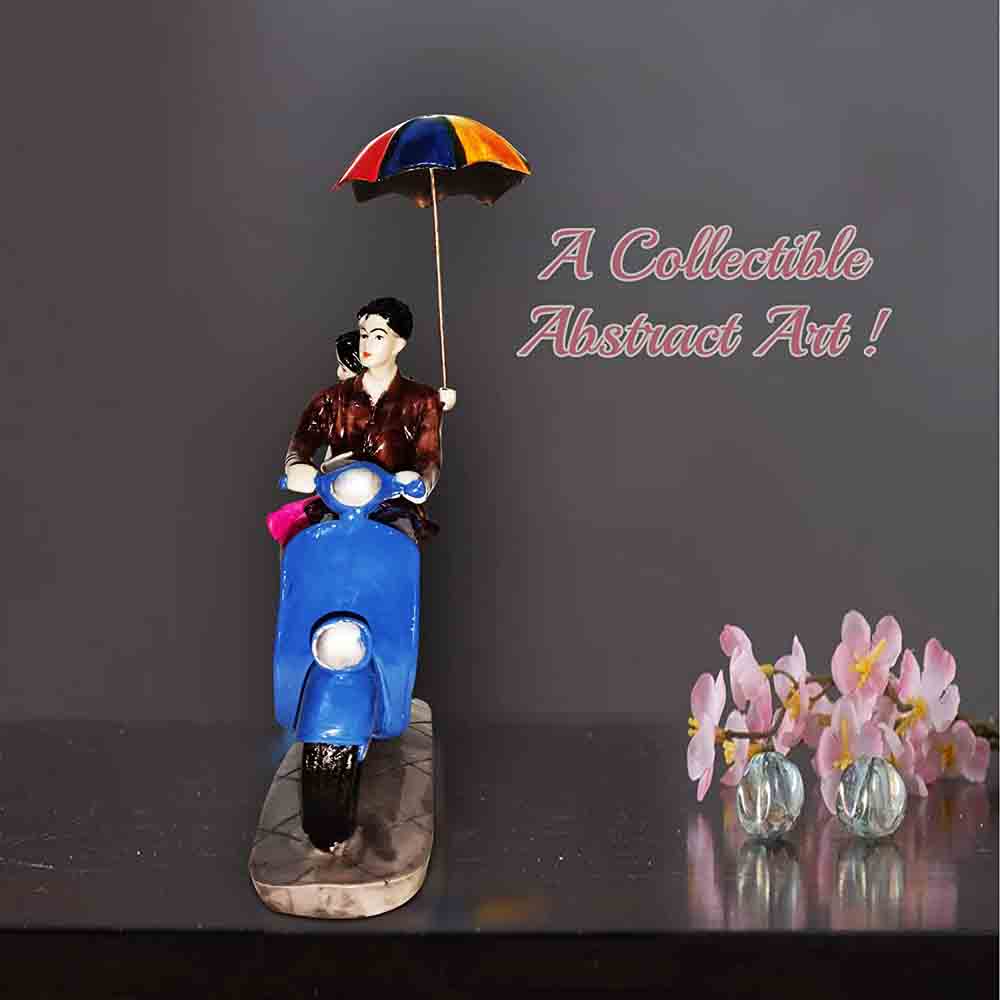 Couple Statue Sitting on Scooter with Umbrella
